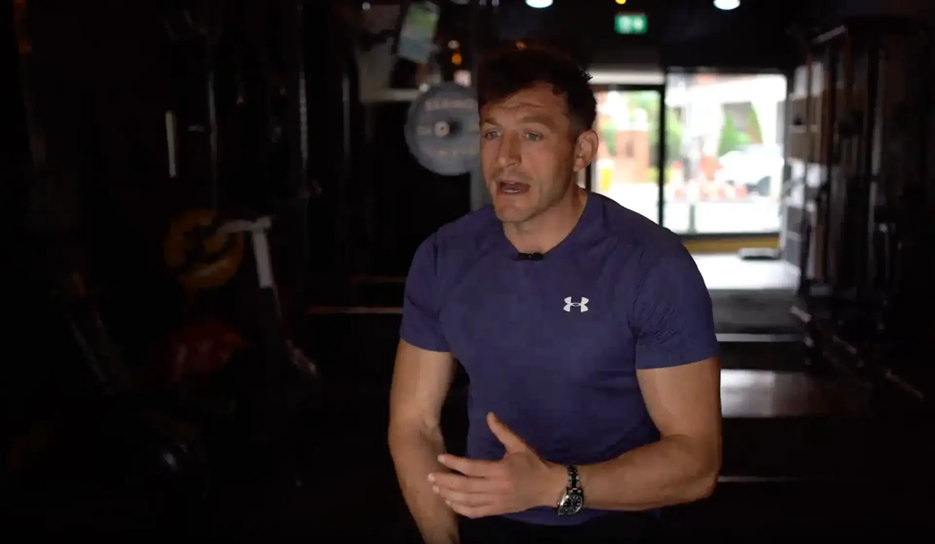 Video testimonial still of a client in a navy top talking in the BTX studio